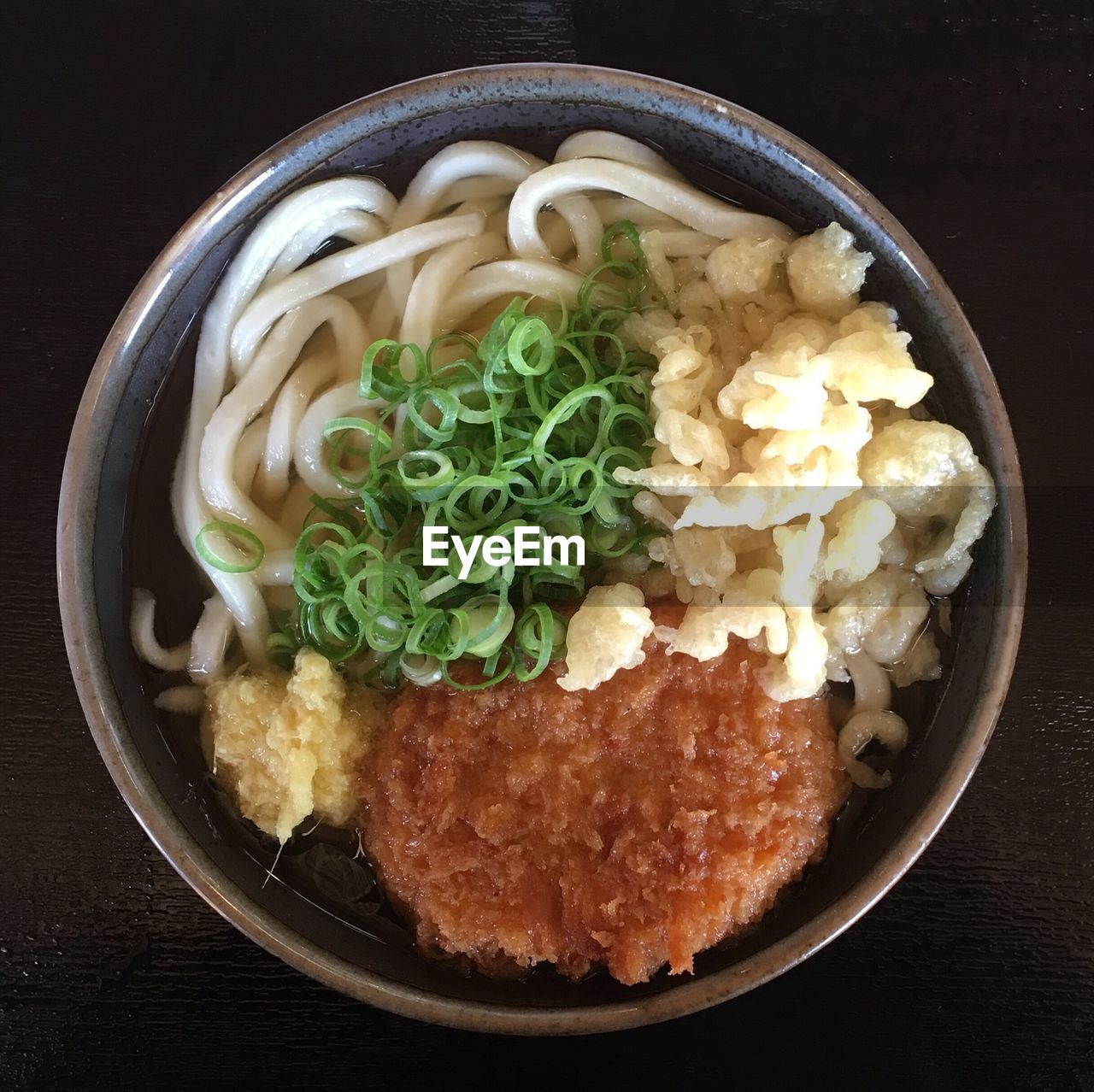 Close-up of udon noodles served on table