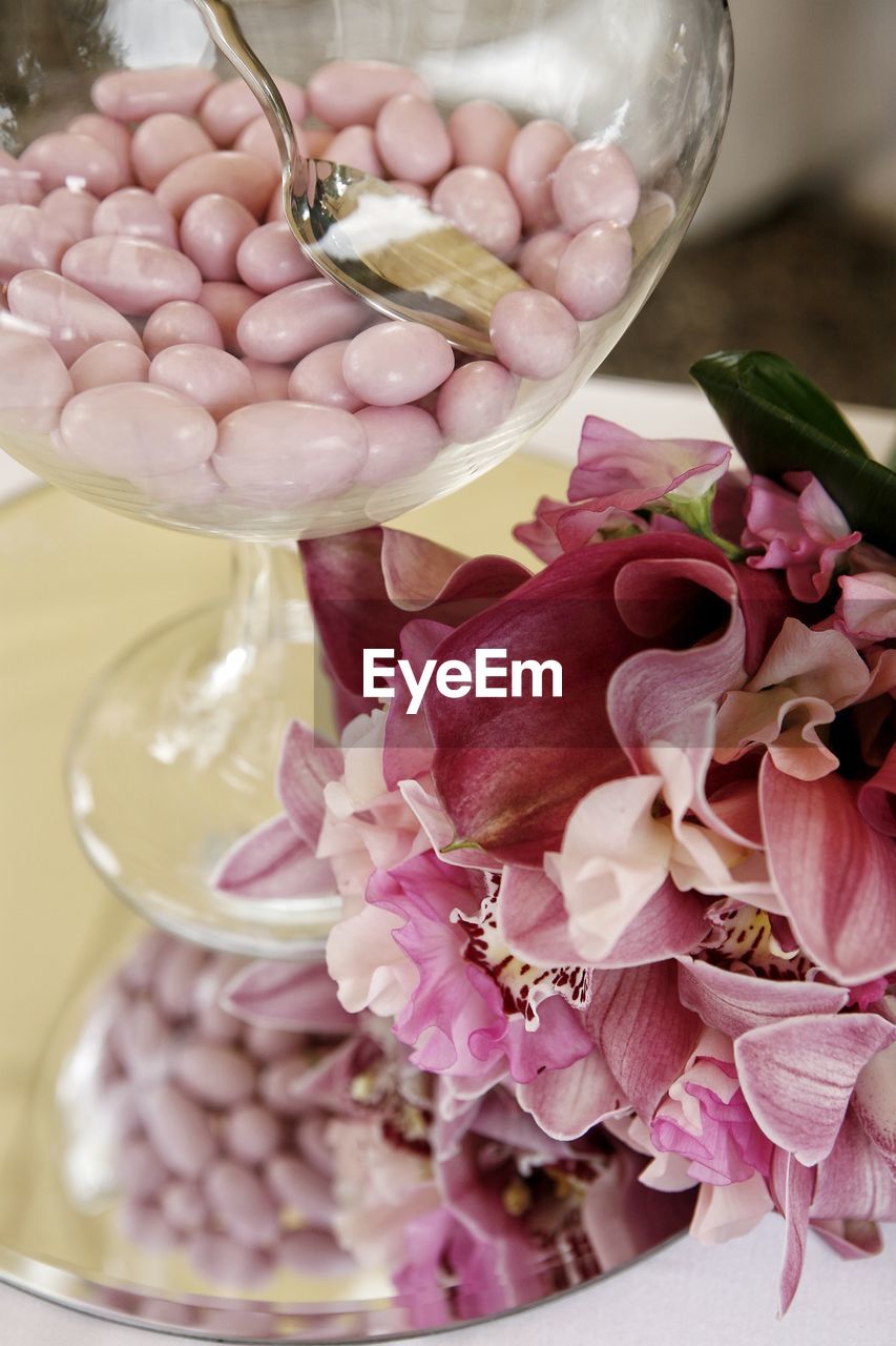 Close-up of rose orchids bouquet with confetti. 