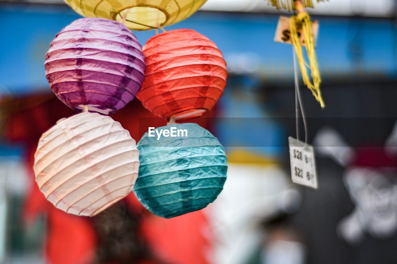 Close-up of multi colored lanterns for sale at market