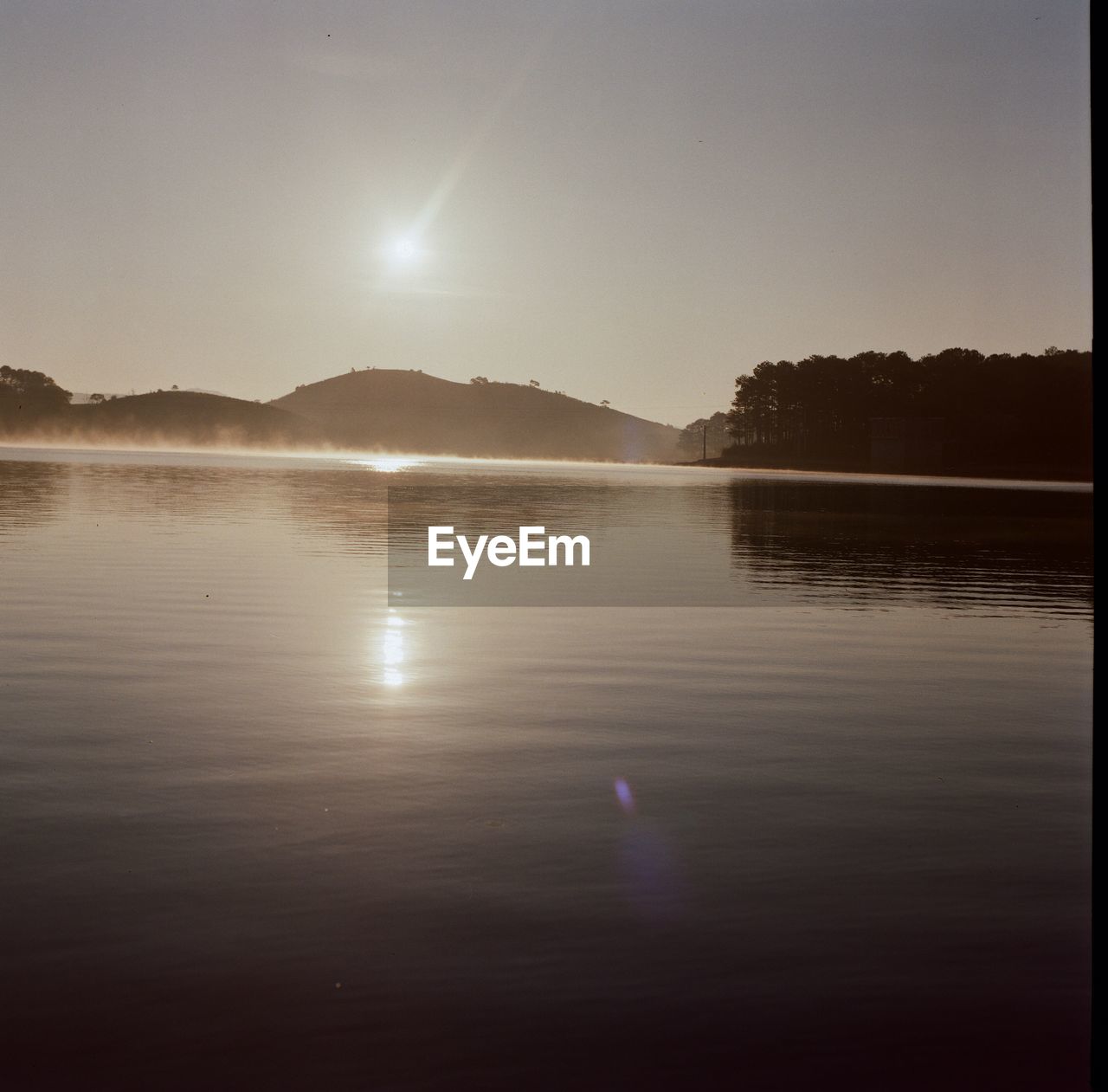 VIEW OF LAKE AGAINST SKY DURING SUNSET