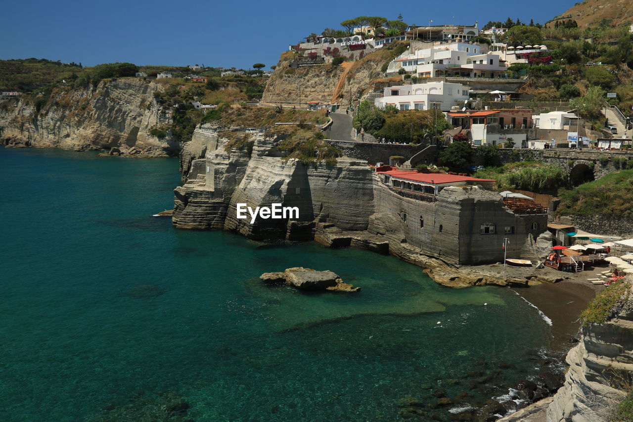 View of buildings by sea