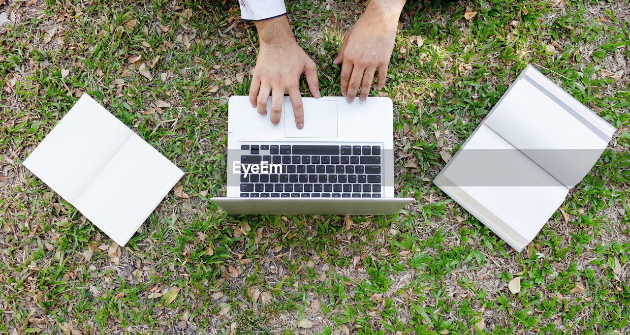 High angle view of person using laptop