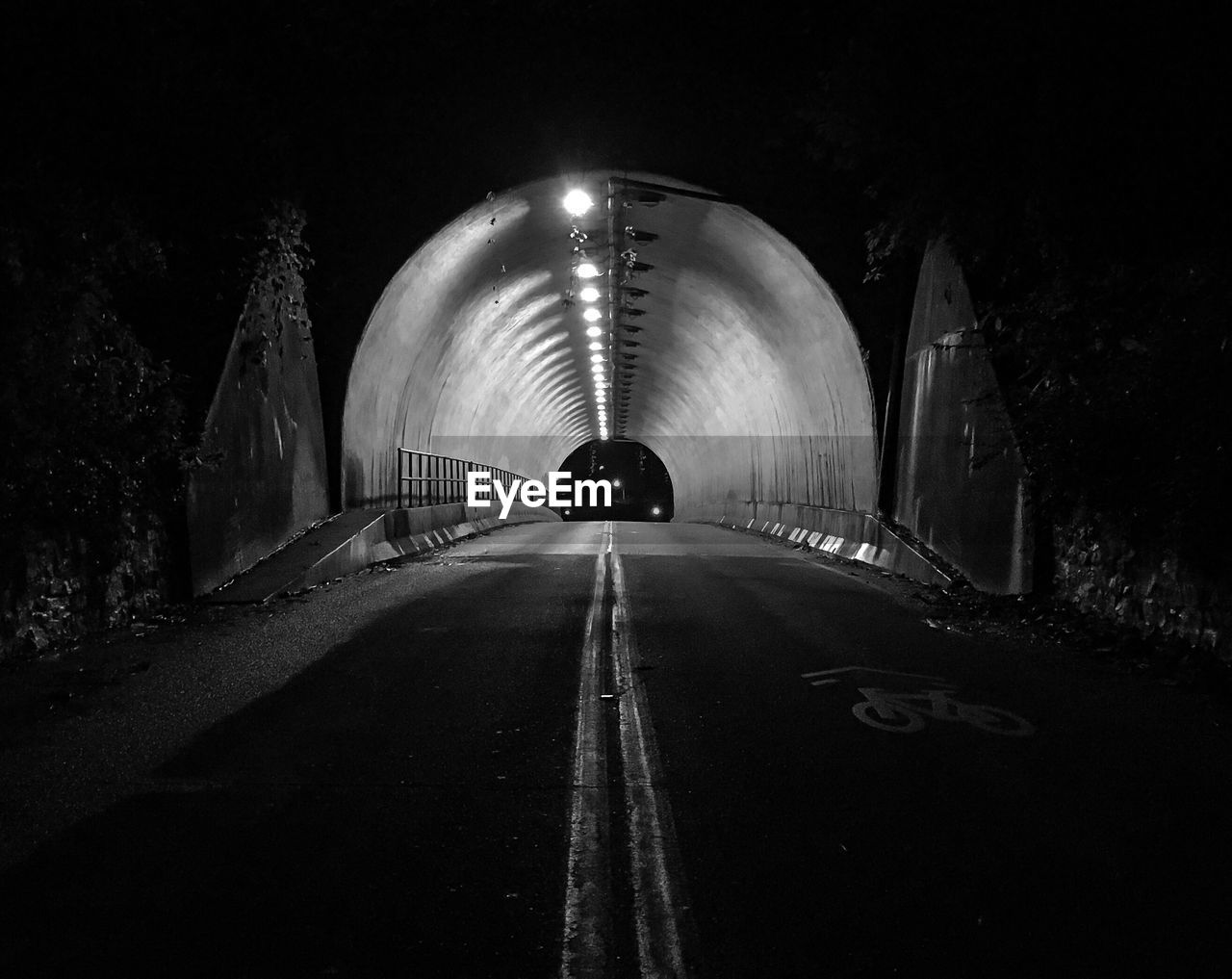 View of illuminated tunnel at night