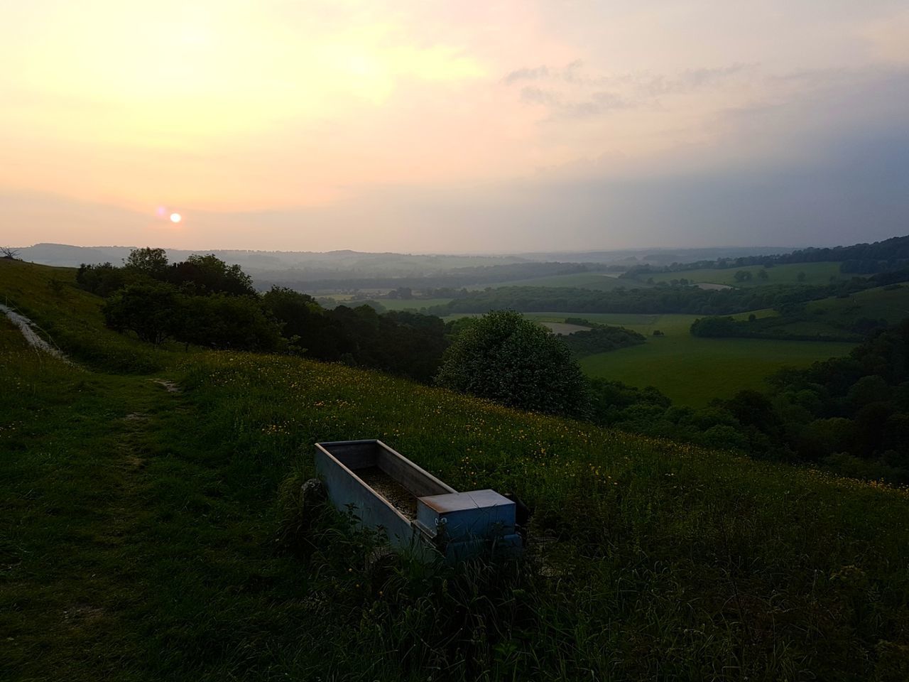 Scenic view of landscape against sky during sunset