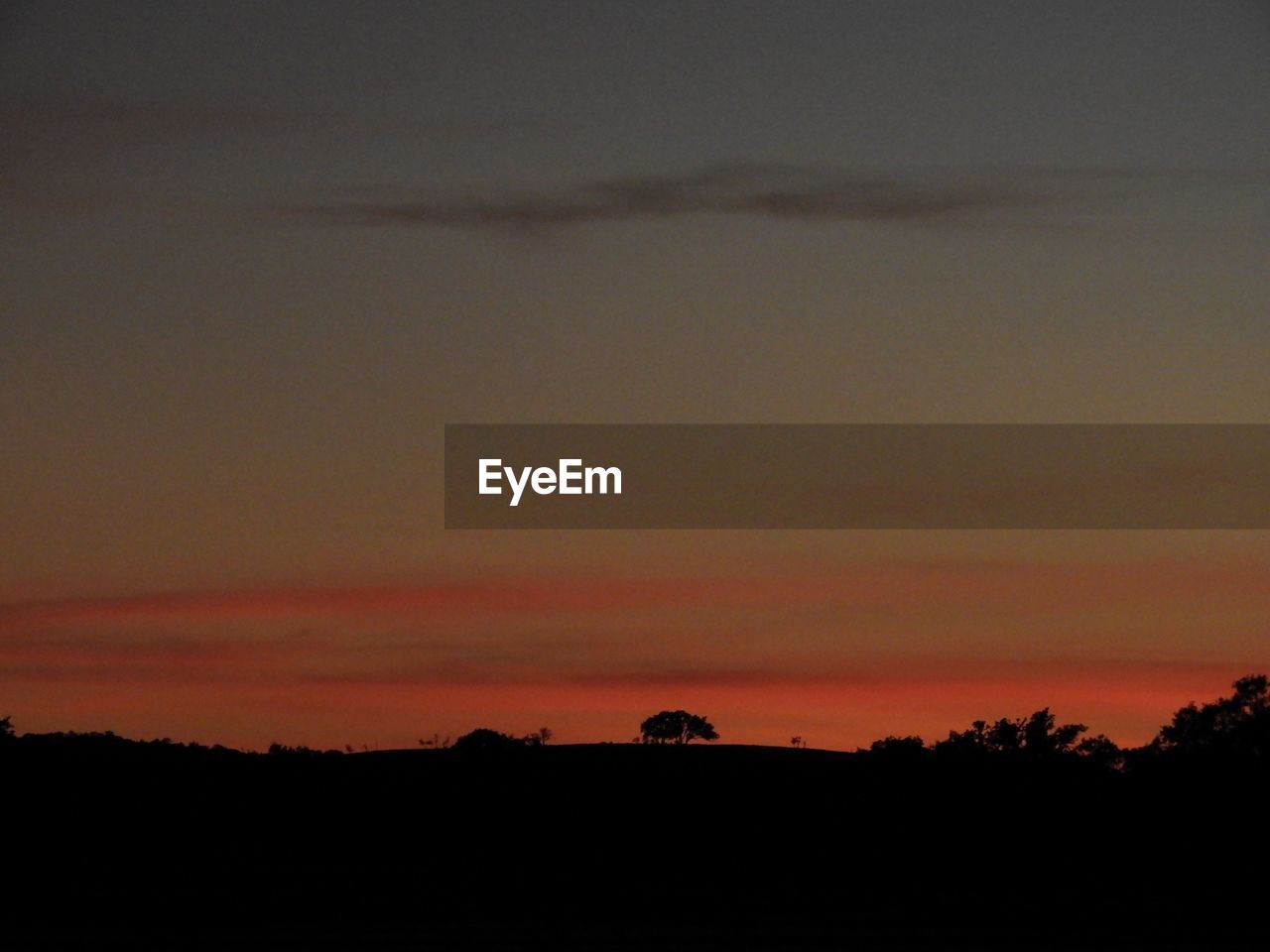 SCENIC VIEW OF SILHOUETTE LANDSCAPE AGAINST SKY DURING SUNSET