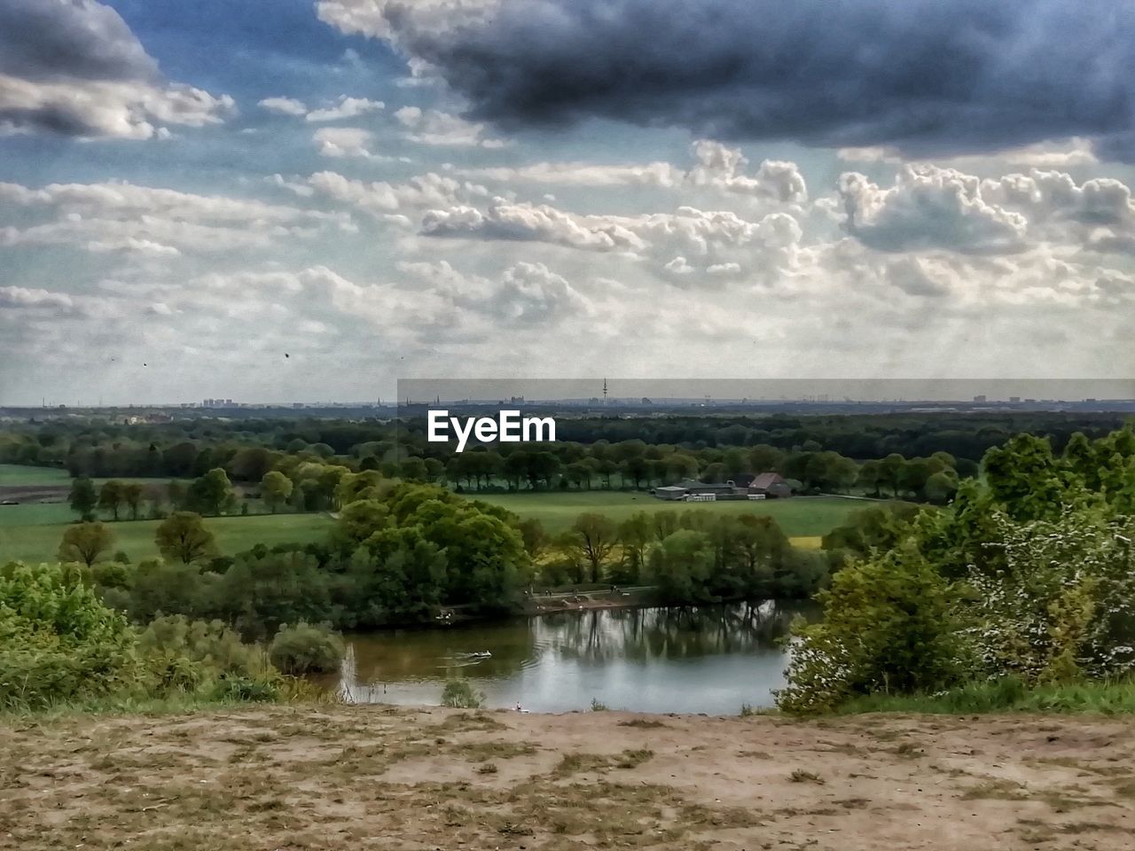 SCENIC VIEW OF LANDSCAPE AND LAKE AGAINST SKY