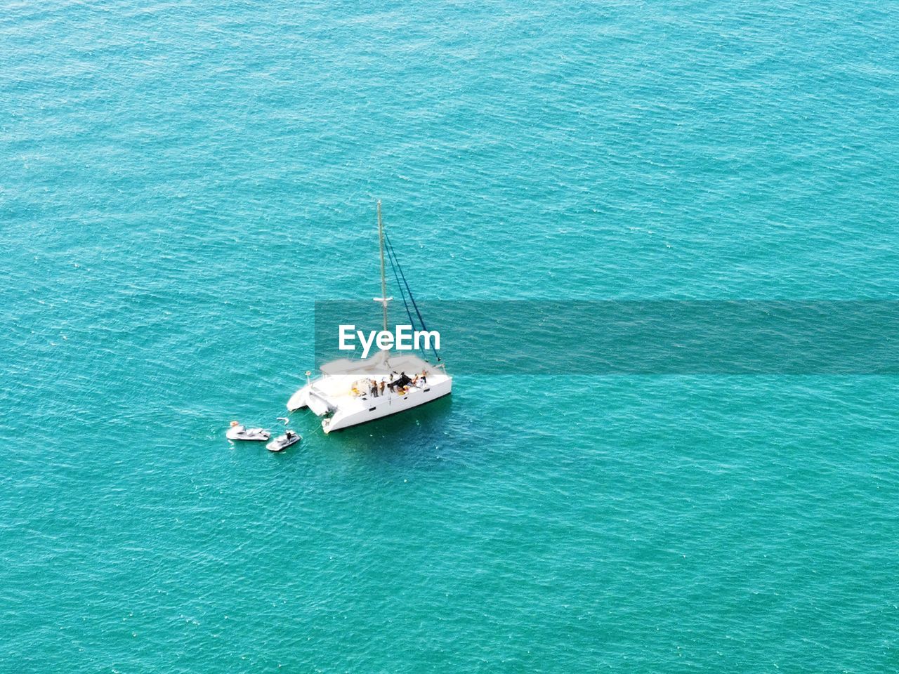 High angle view of sailboat sailing in sea