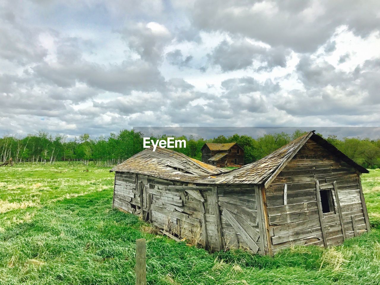 BUILT STRUCTURES ON FIELD AGAINST SKY