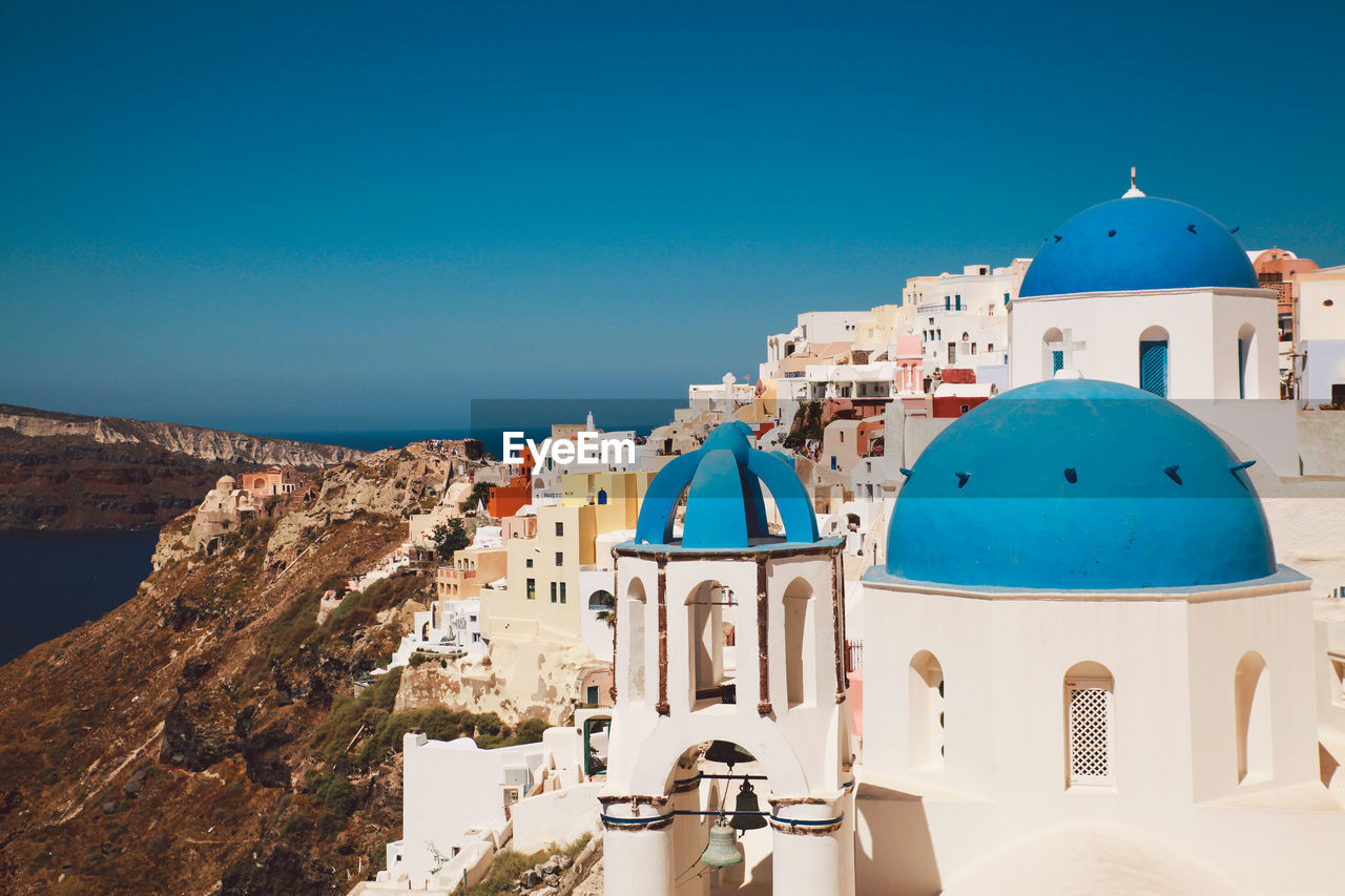 Church and buildings in city at santorini