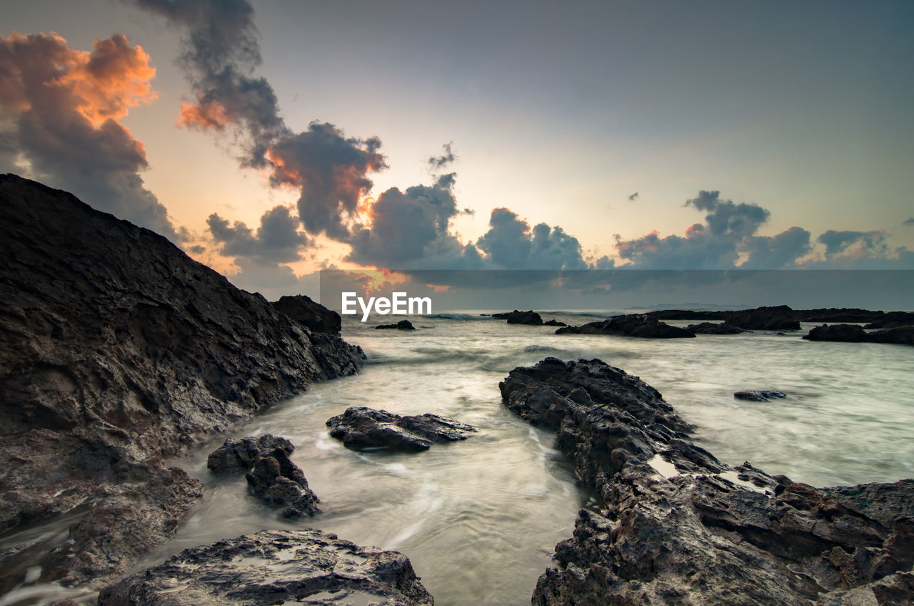 Rocky coastal feature against the sky