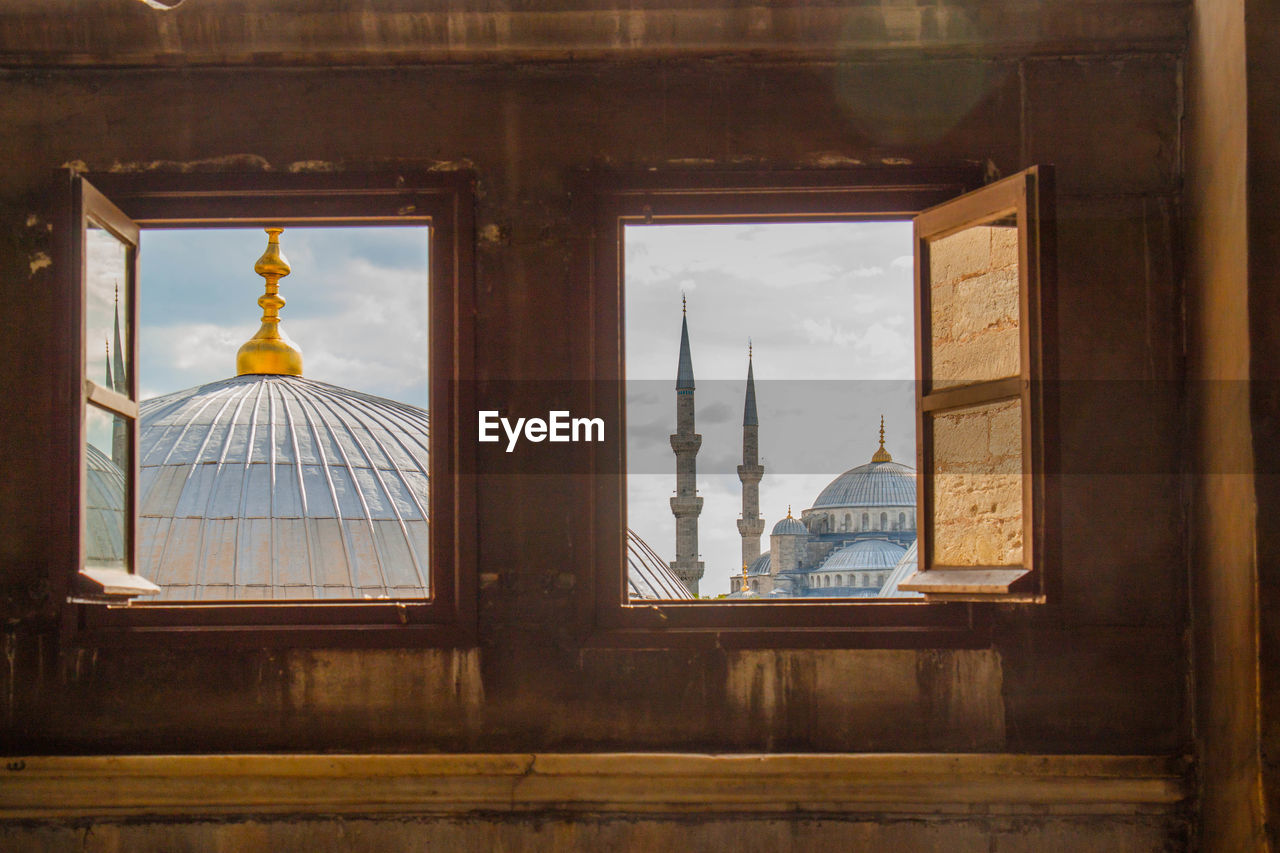 Historic mosque seen through windows