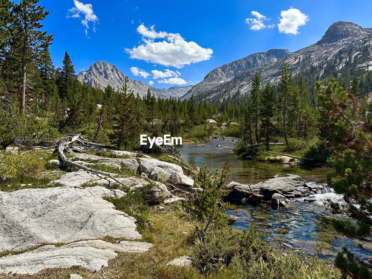 scenic view of river amidst snowcapped mountains against sky