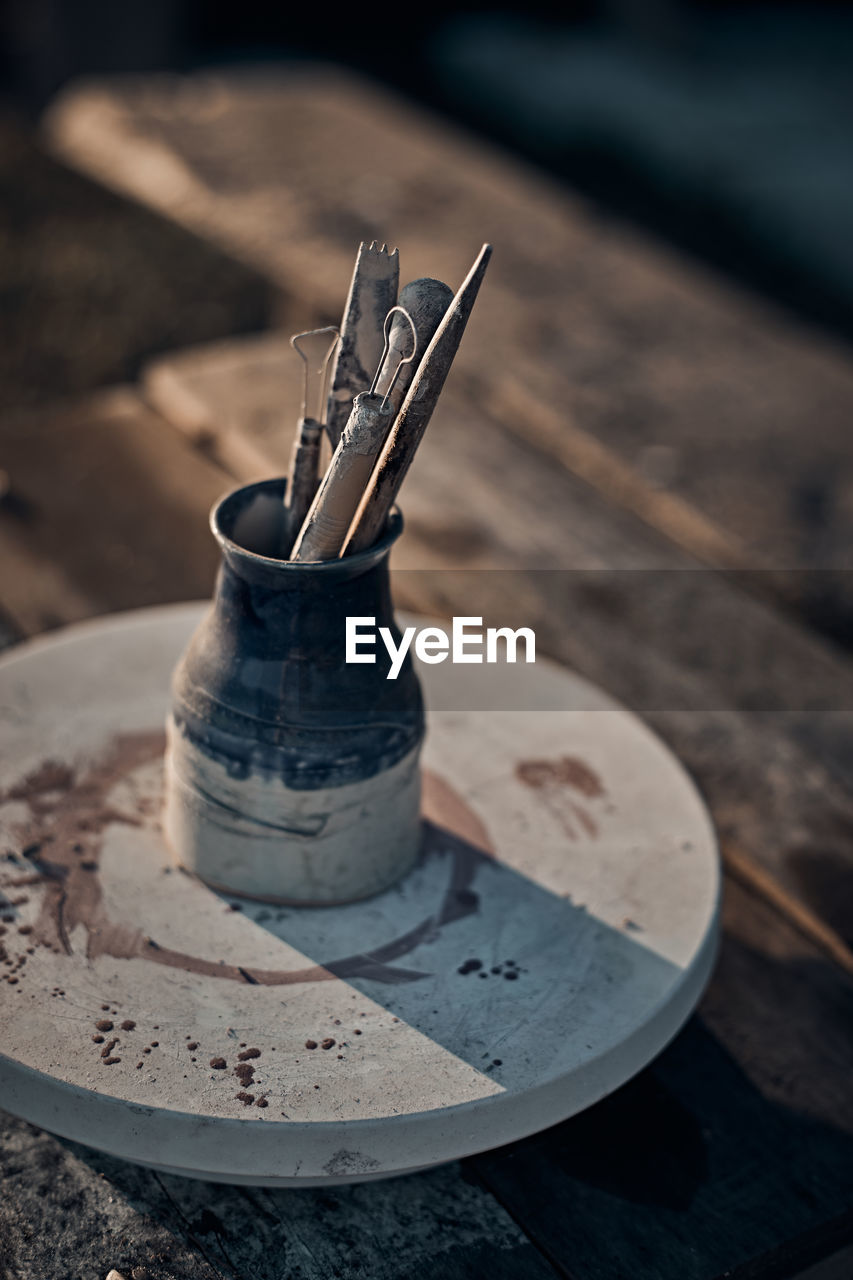 View of work tools in container on table