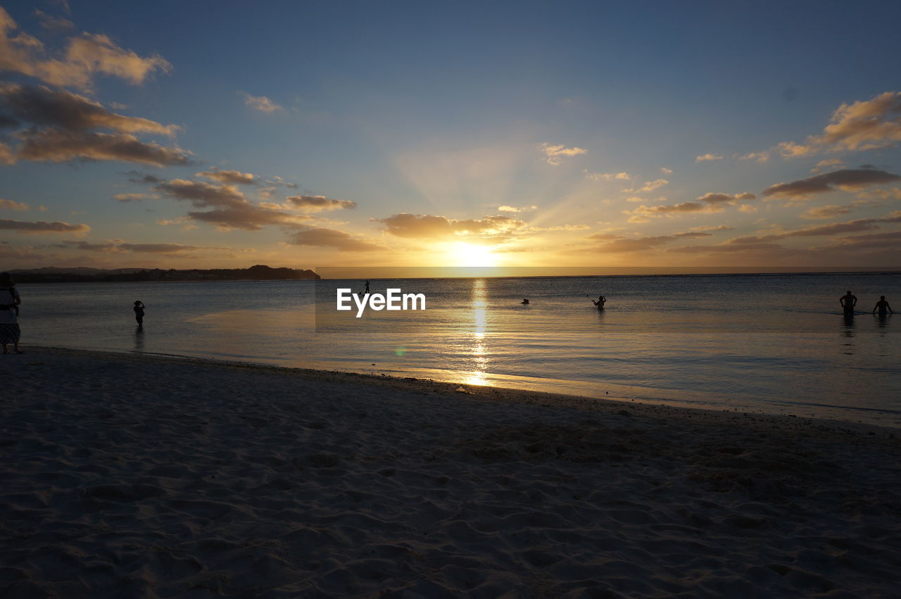 Scenic view of beach against sky during sunset