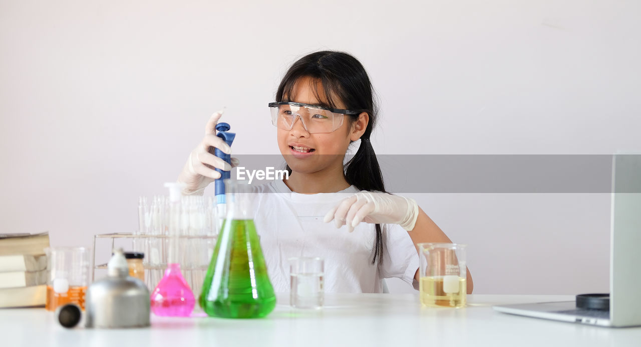 Girl experimenting at laboratory