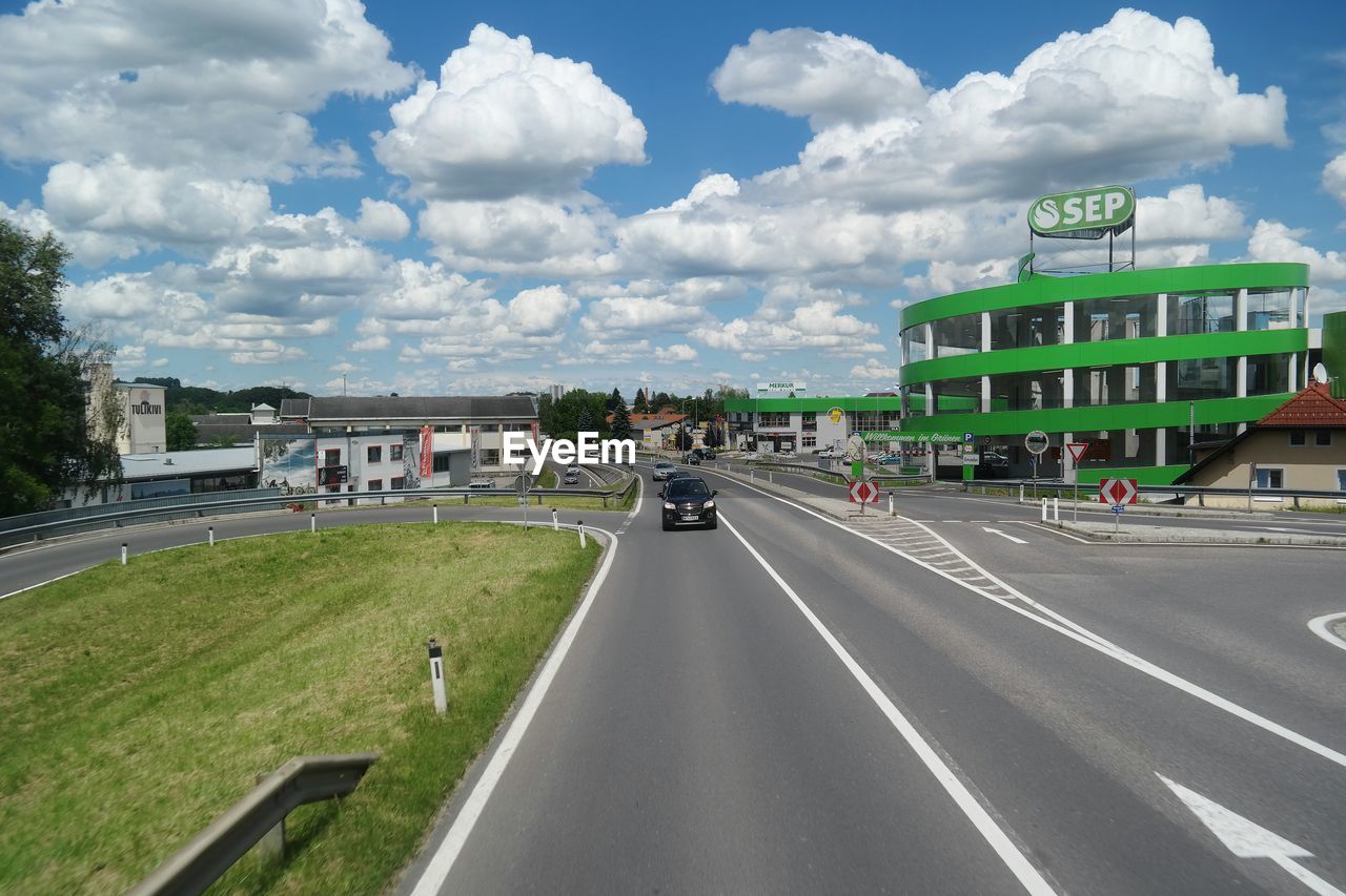 VIEW OF ROAD AGAINST CLOUDY SKY