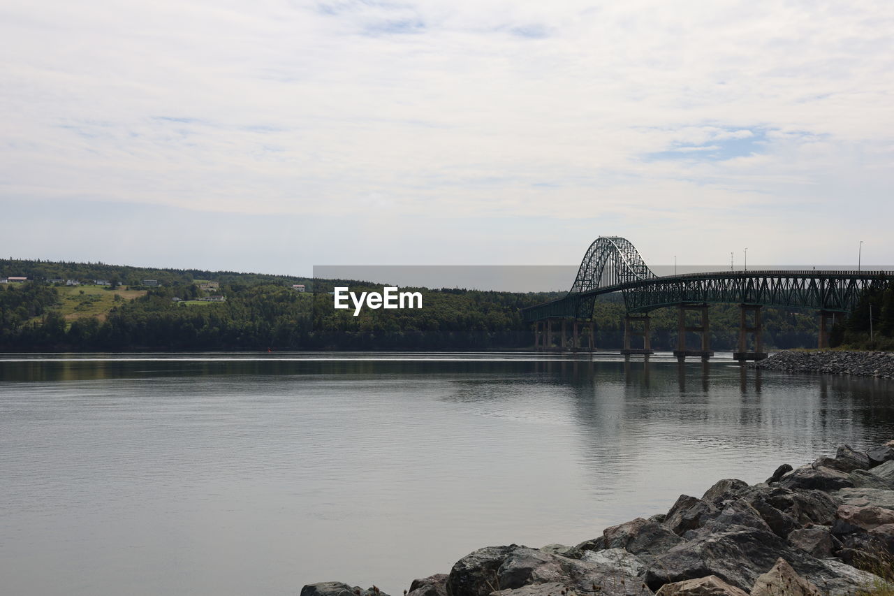 water, reflection, sky, architecture, bridge, built structure, river, reservoir, nature, cloud, travel destinations, shore, travel, no people, body of water, city, tourism, transportation, scenics - nature, outdoors, day, landscape, tree, beauty in nature