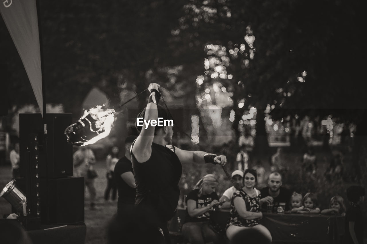 GROUP OF PEOPLE ENJOYING MUSIC CONCERT