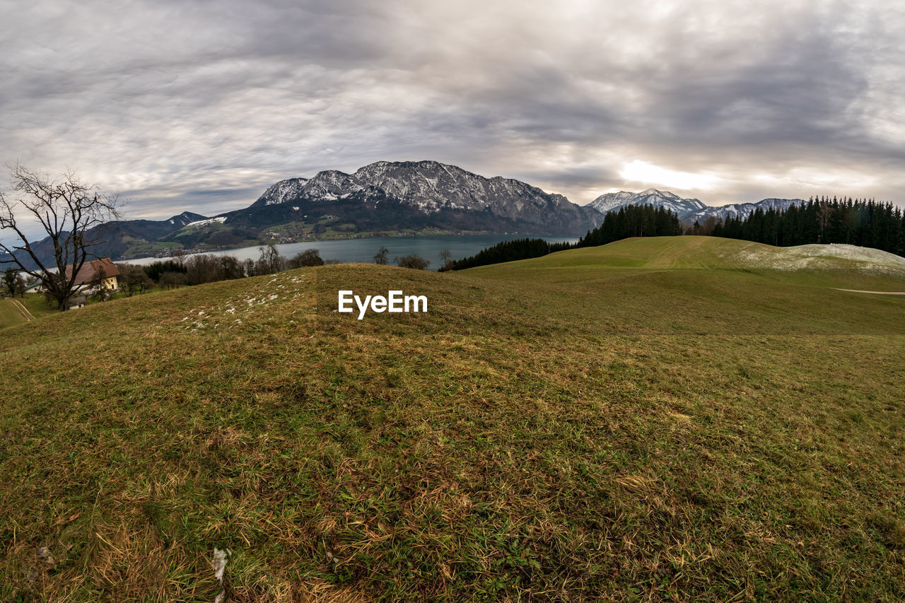 Scenic view of landscape and mountains against sky