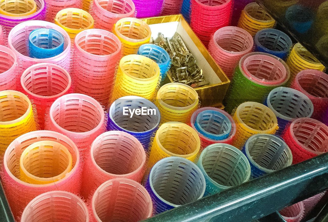 High angle view of colorful hair curlers