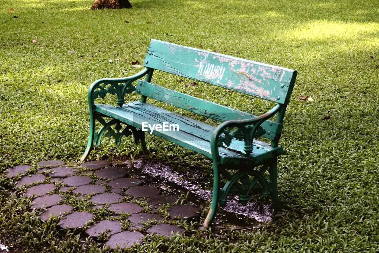 EMPTY CHAIRS AND TABLES IN PARK