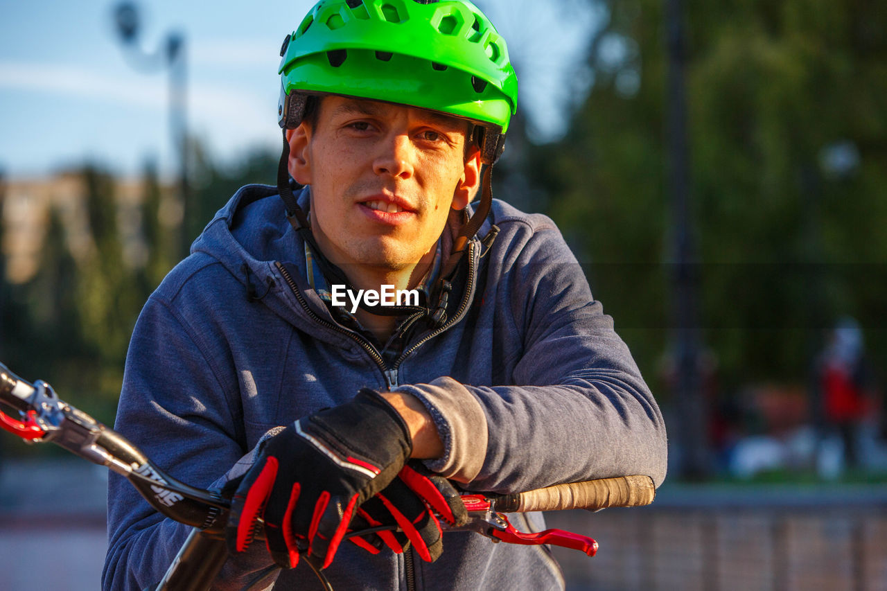 Portrait of man wearing cycling helmet