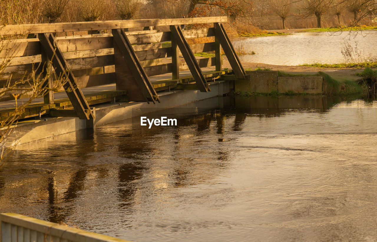 water, reflection, river, architecture, waterway, nature, built structure, no people, bridge, environment, outdoors, day, accidents and disasters