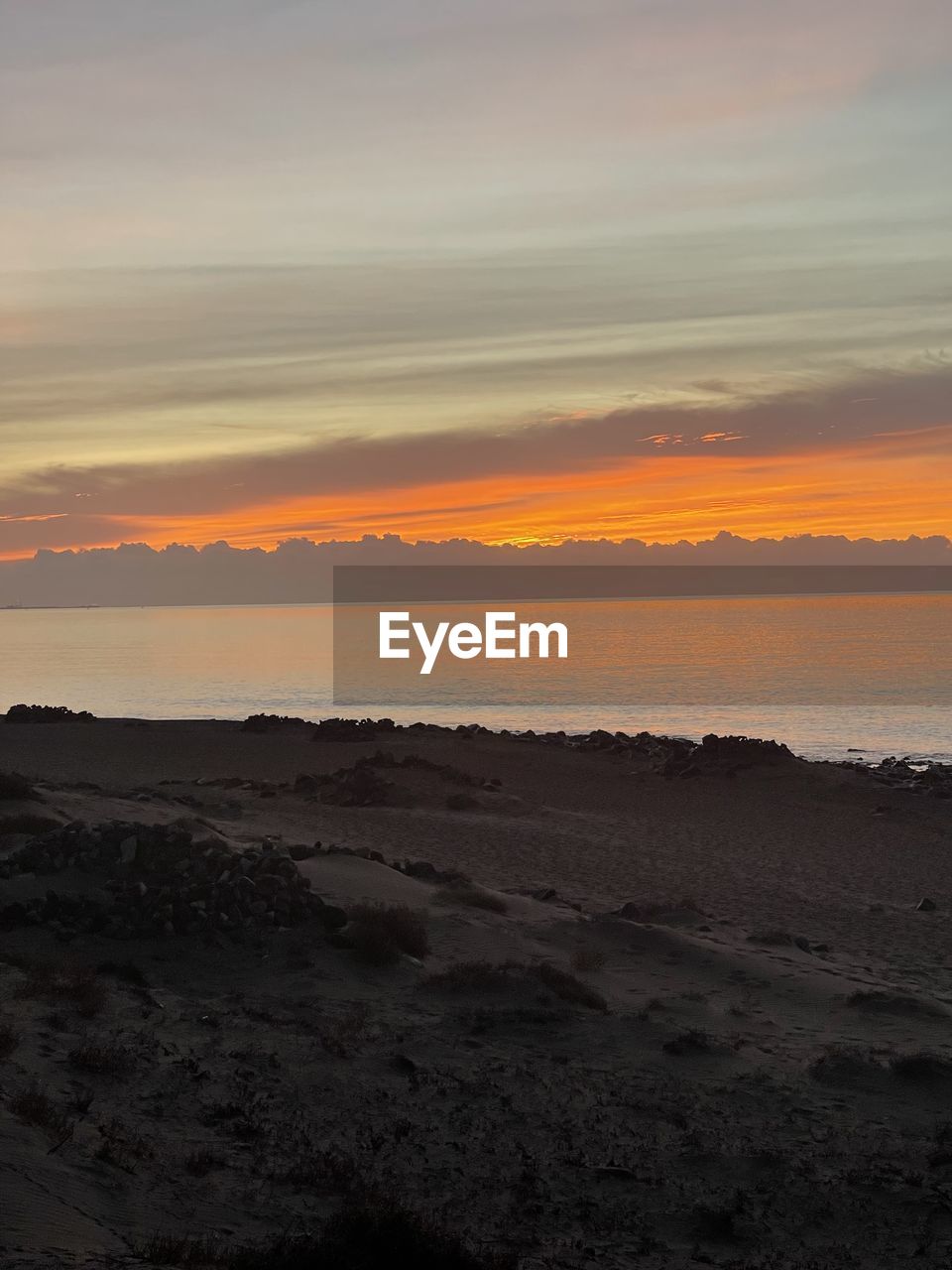 water, beauty in nature, nature, no people, scenics - nature, land, sky, outdoors, sunset, reflection, orange color, motion, sea, environment, day, light, panoramic