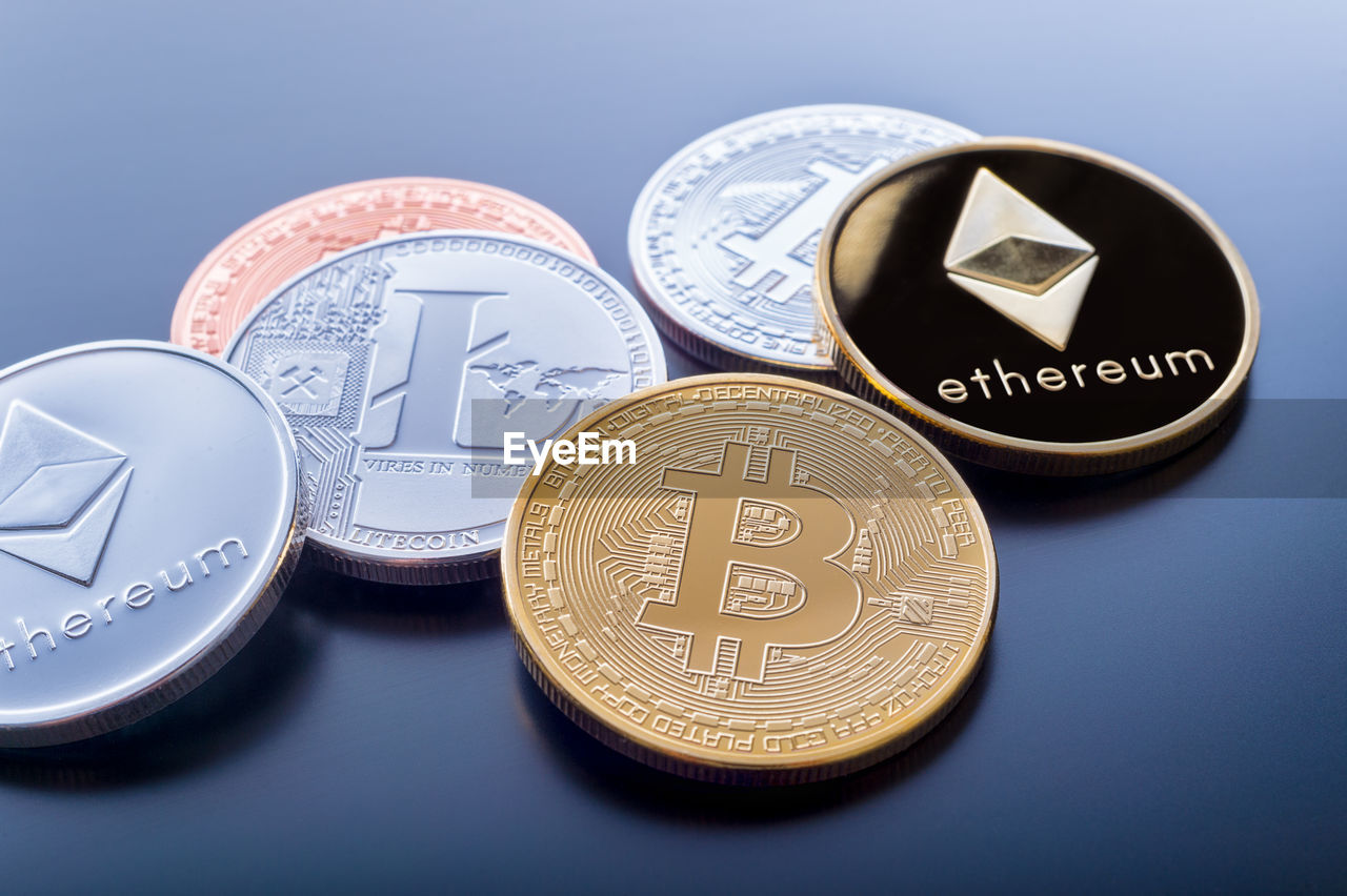 CLOSE-UP OF COINS ON TABLE