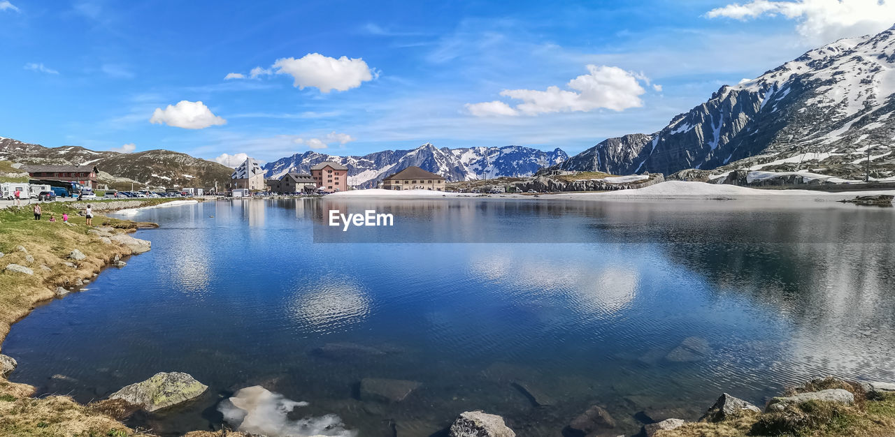 Ultra wide panorama of the lake in the gotthardpass with snow