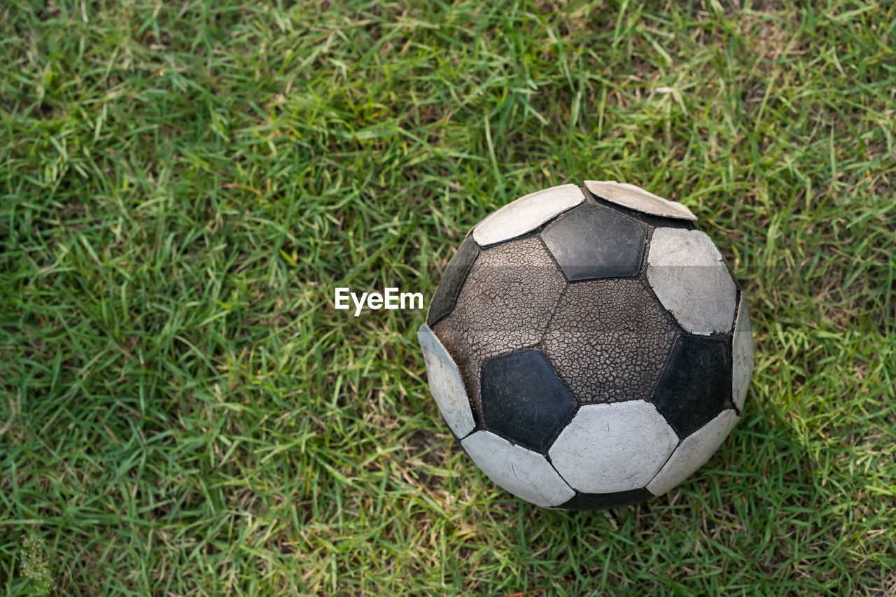 high angle view of soccer ball on grassy field