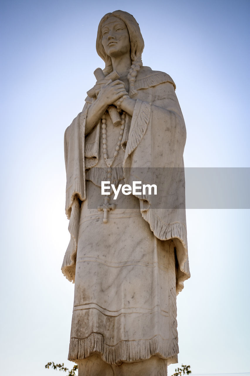 Low angle view of statue against sky. chatholic saint