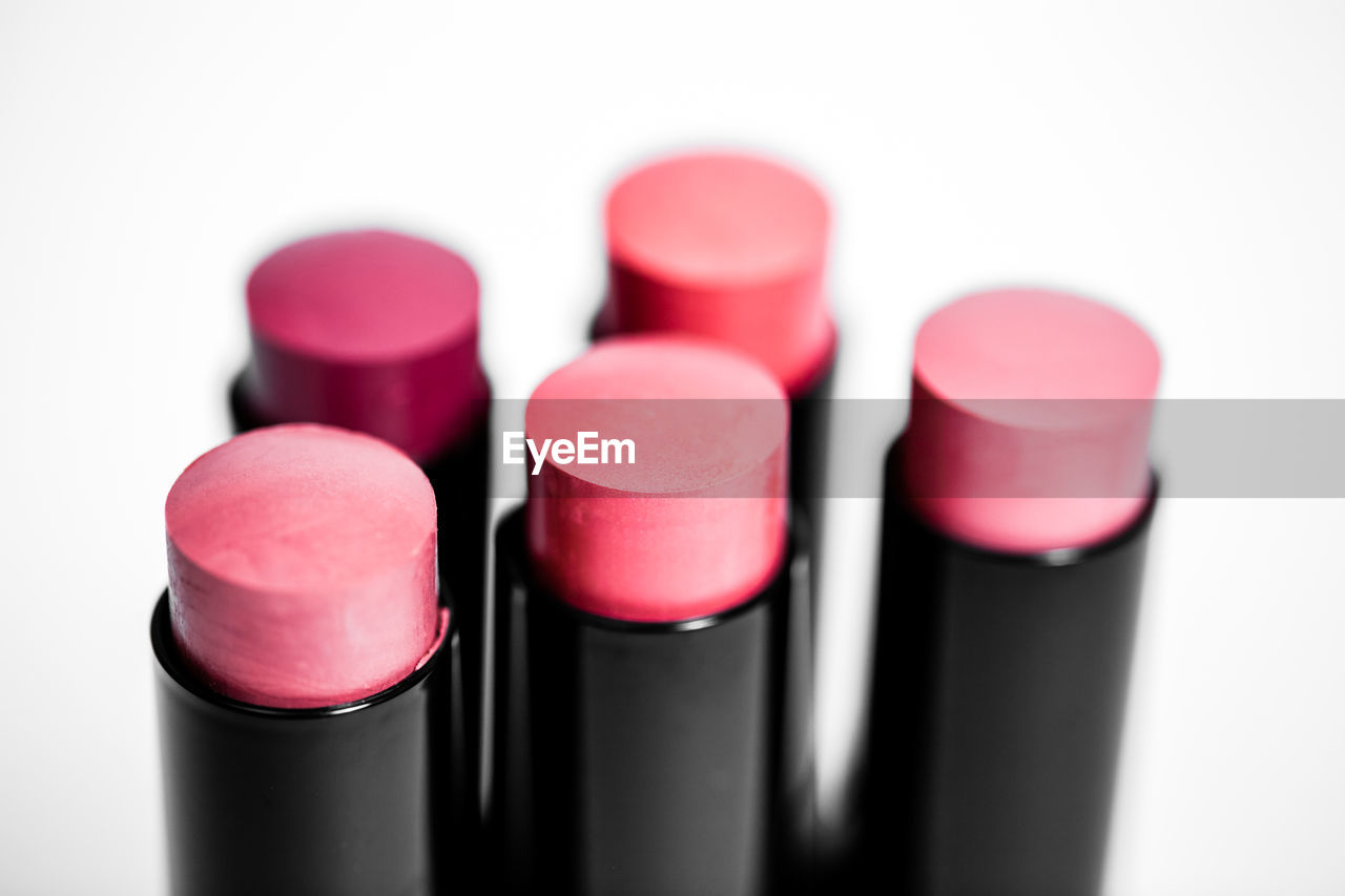 Close-up of lipsticks against white background