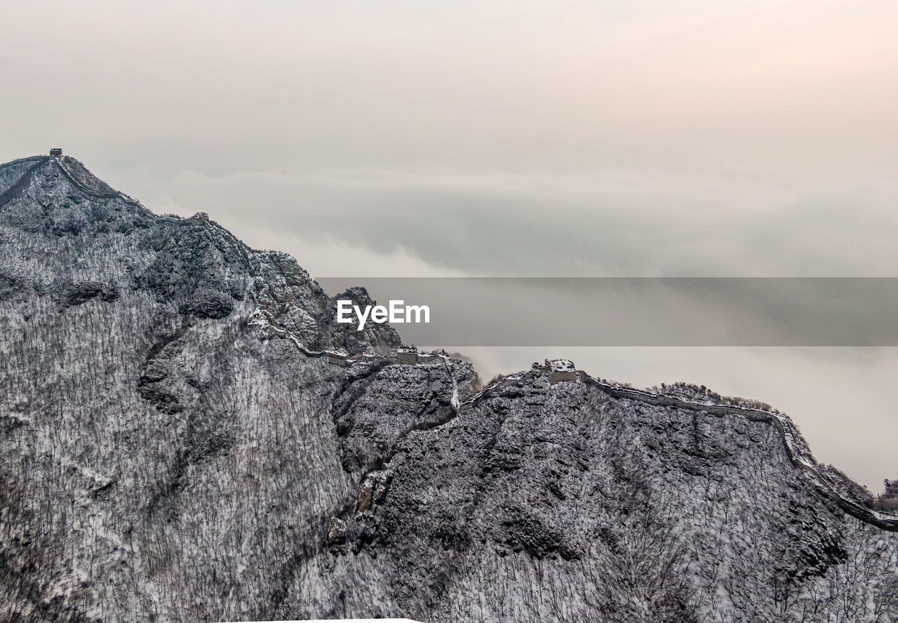 Low angle view of rock formation against sky