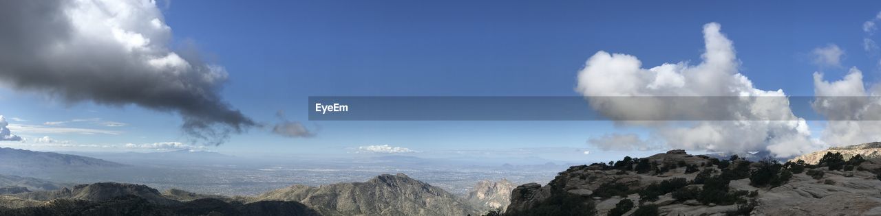 PANORAMIC VIEW OF CLOUDS OVER MOUNTAINS