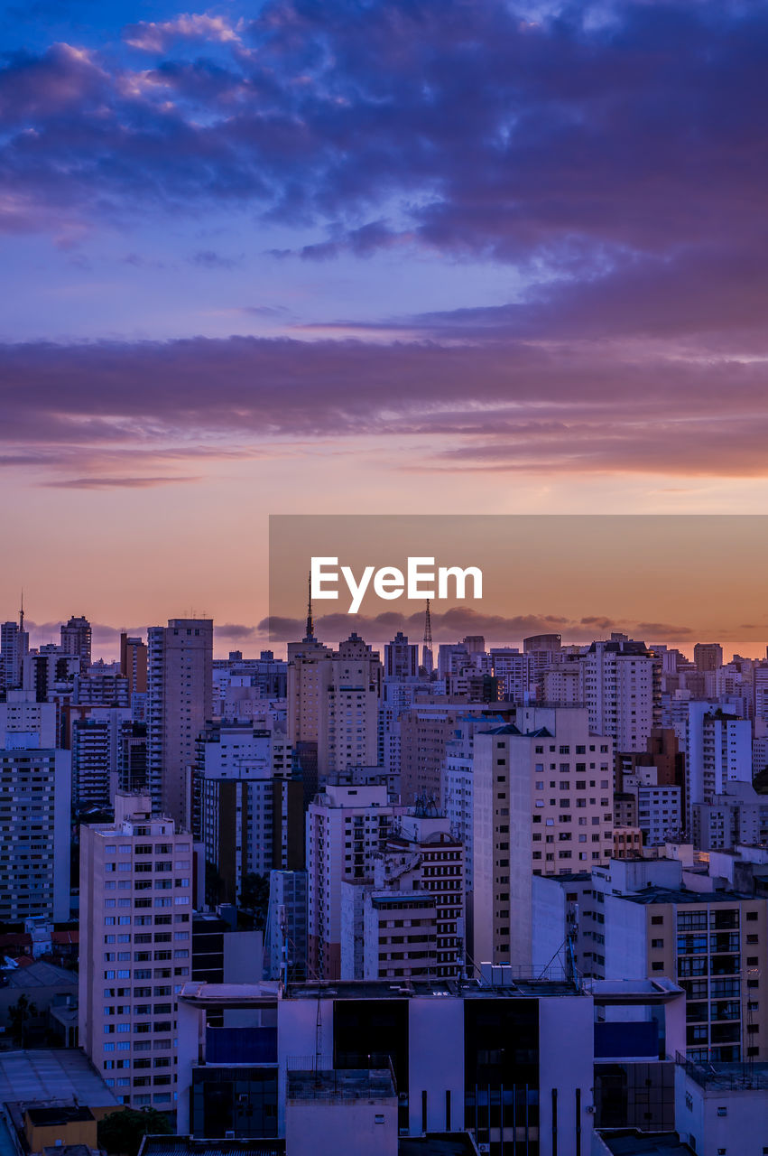 High angle view of buildings against sky during sunset