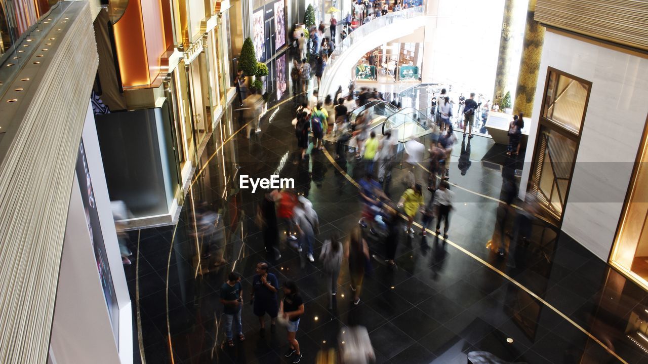 HIGH ANGLE VIEW OF PEOPLE AT SHOPPING MALL