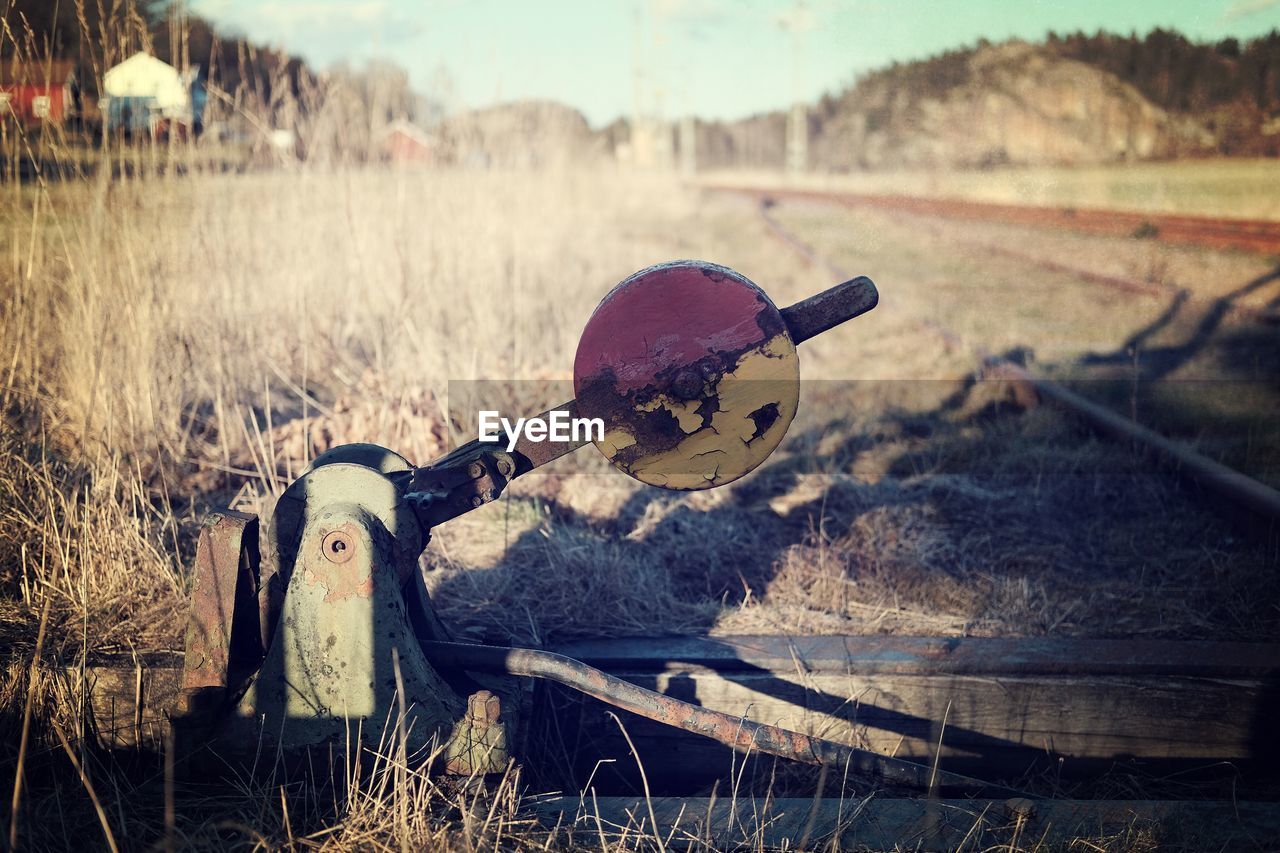 Abandoned railroad buffer stop on field