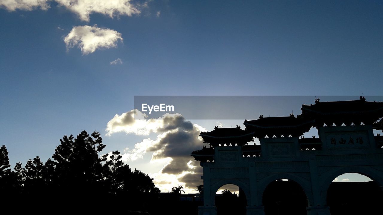 LOW ANGLE VIEW OF BUILT STRUCTURES AGAINST BLUE SKY