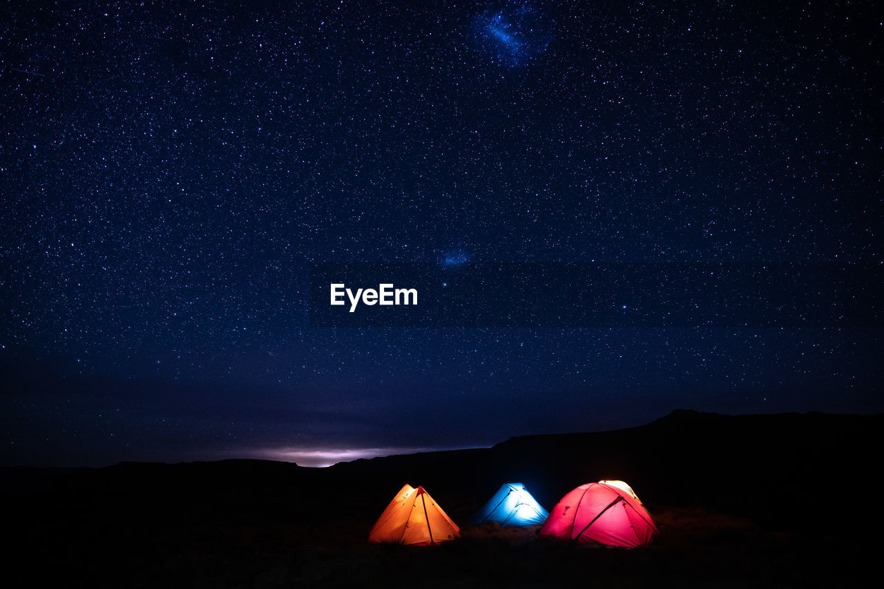 Low angle view of star field against sky at night in drakensberg, south africa.