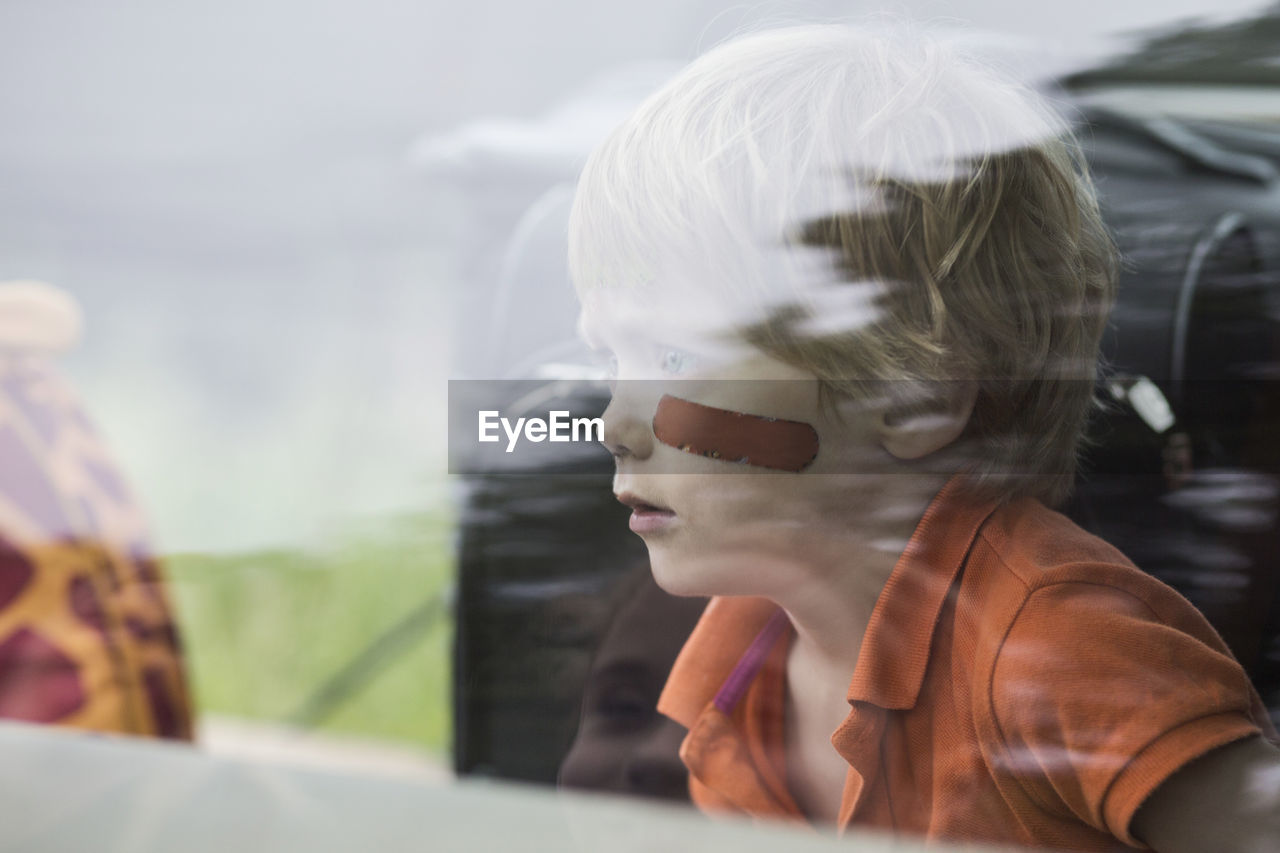 Boy sitting in car