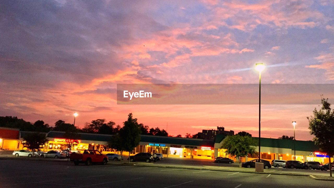 CARS ON ROAD AT SUNSET