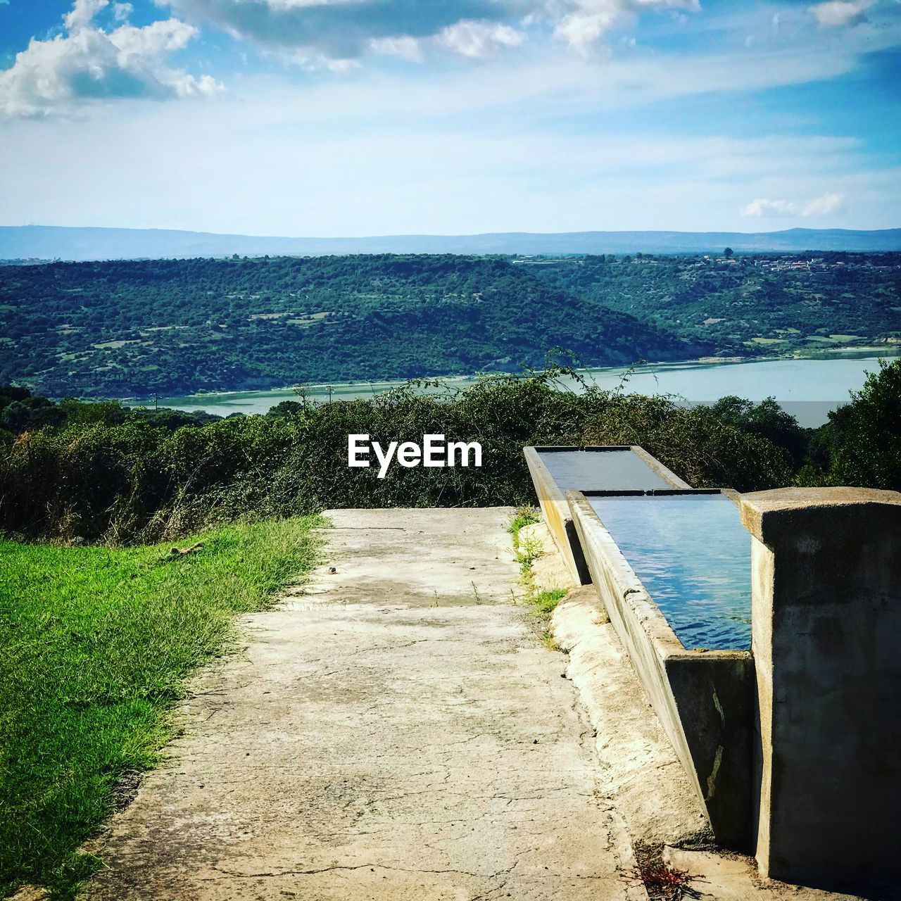 SCENIC VIEW OF LANDSCAPE AND MOUNTAINS AGAINST SKY