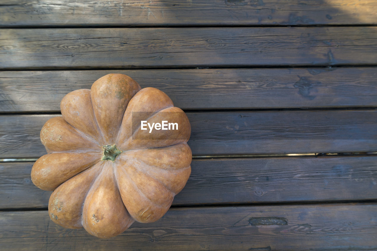 Directly above shot of pumpkin on wooden table