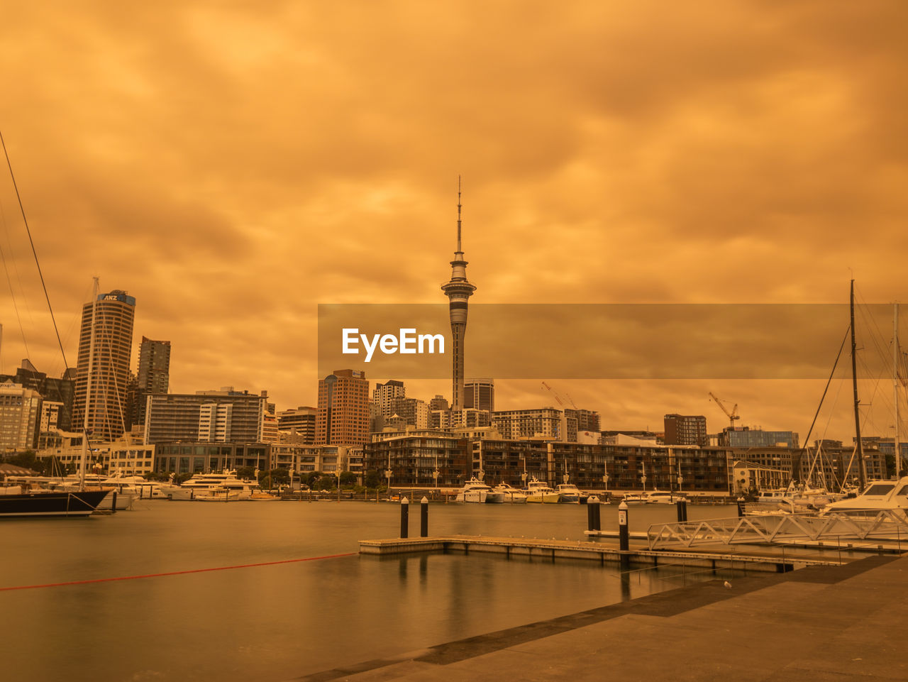 VIEW OF BUILDINGS AGAINST CLOUDY SKY
