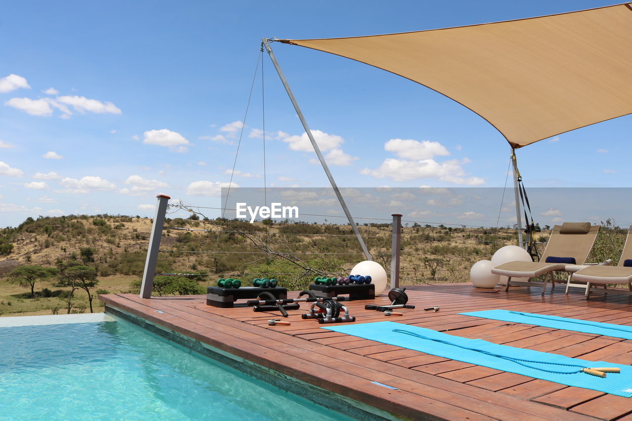 VIEW OF SWIMMING POOL AGAINST SEA