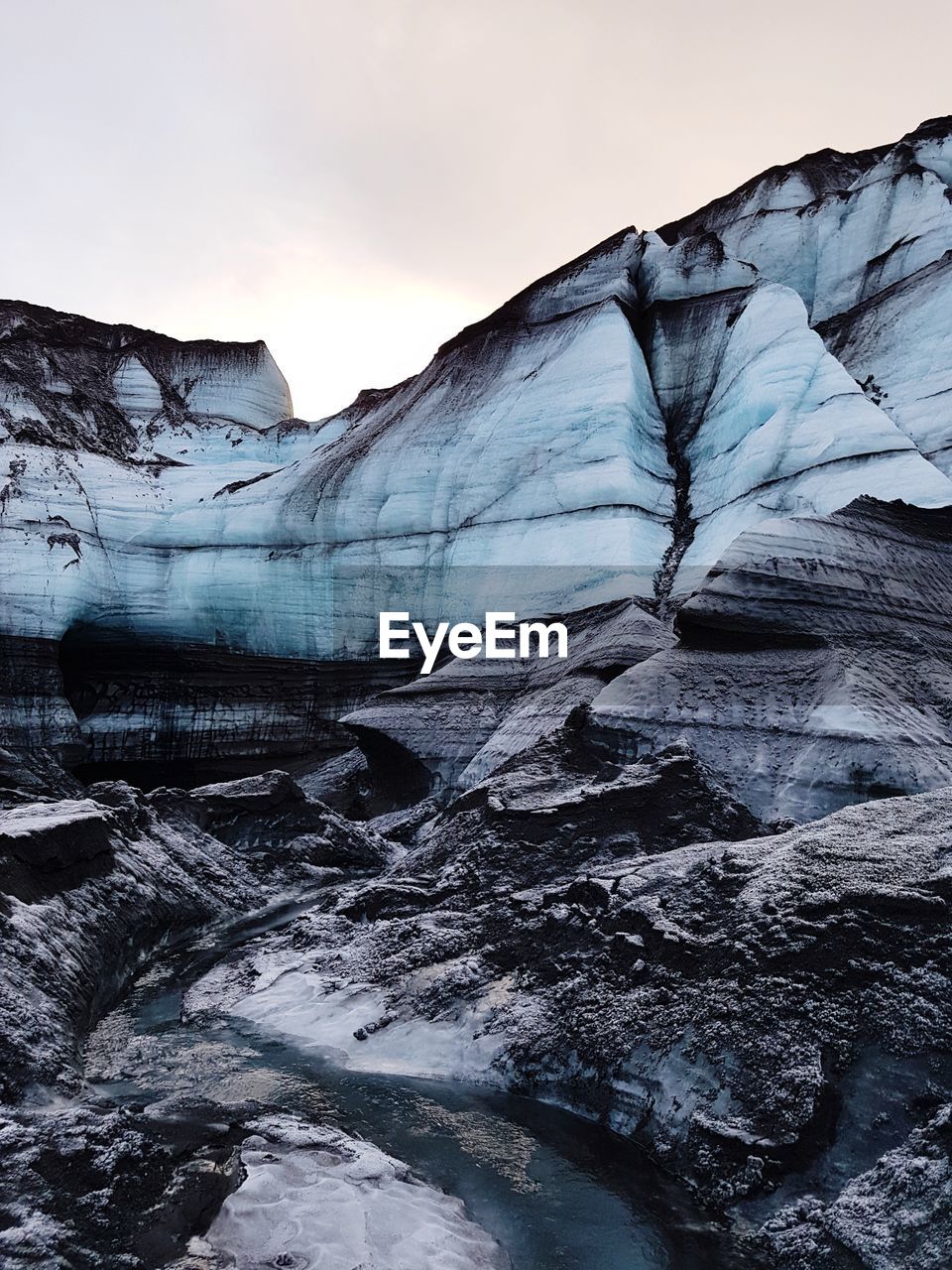 Scenic view of snowcapped mountains against sky during winter