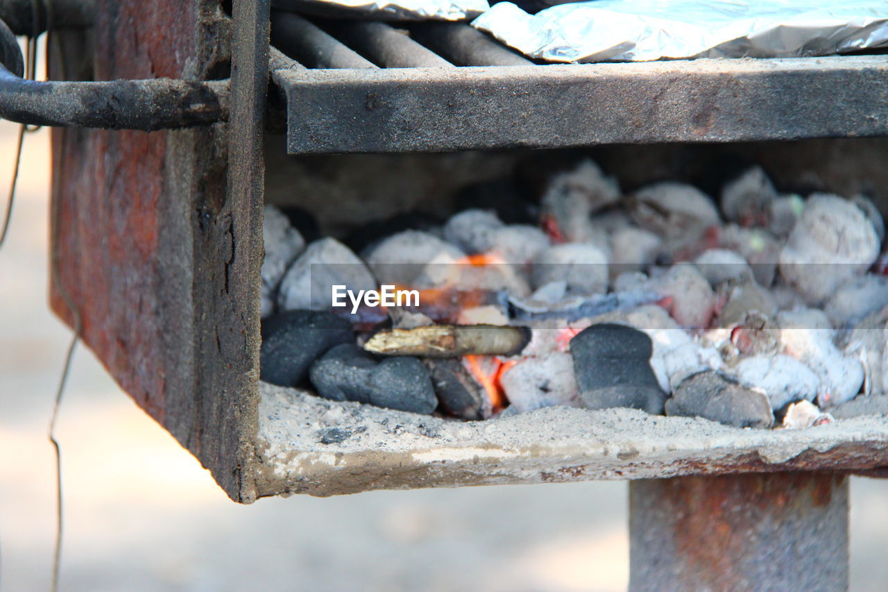 Close-up of firewood on barbecue grill