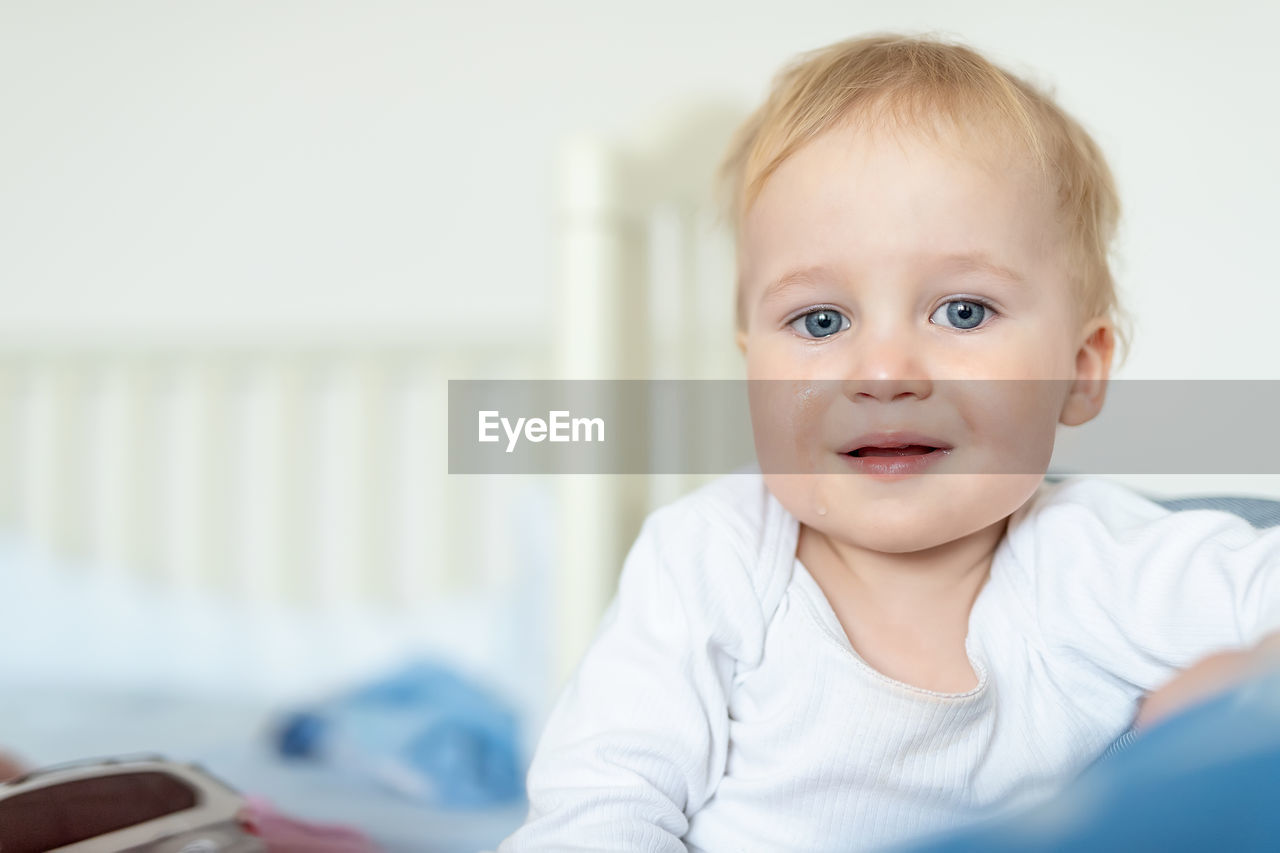 Portrait of cute baby boy crying