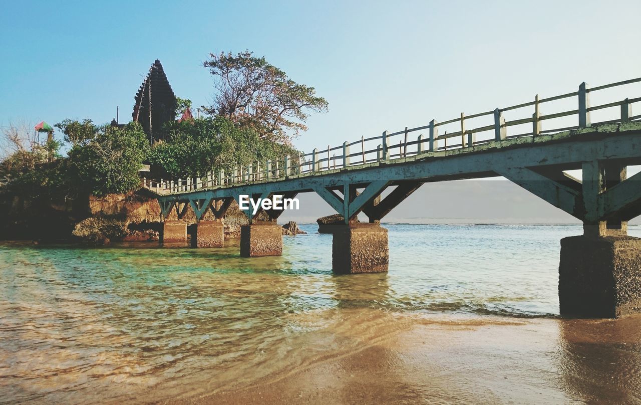 Bridge over river against clear sky